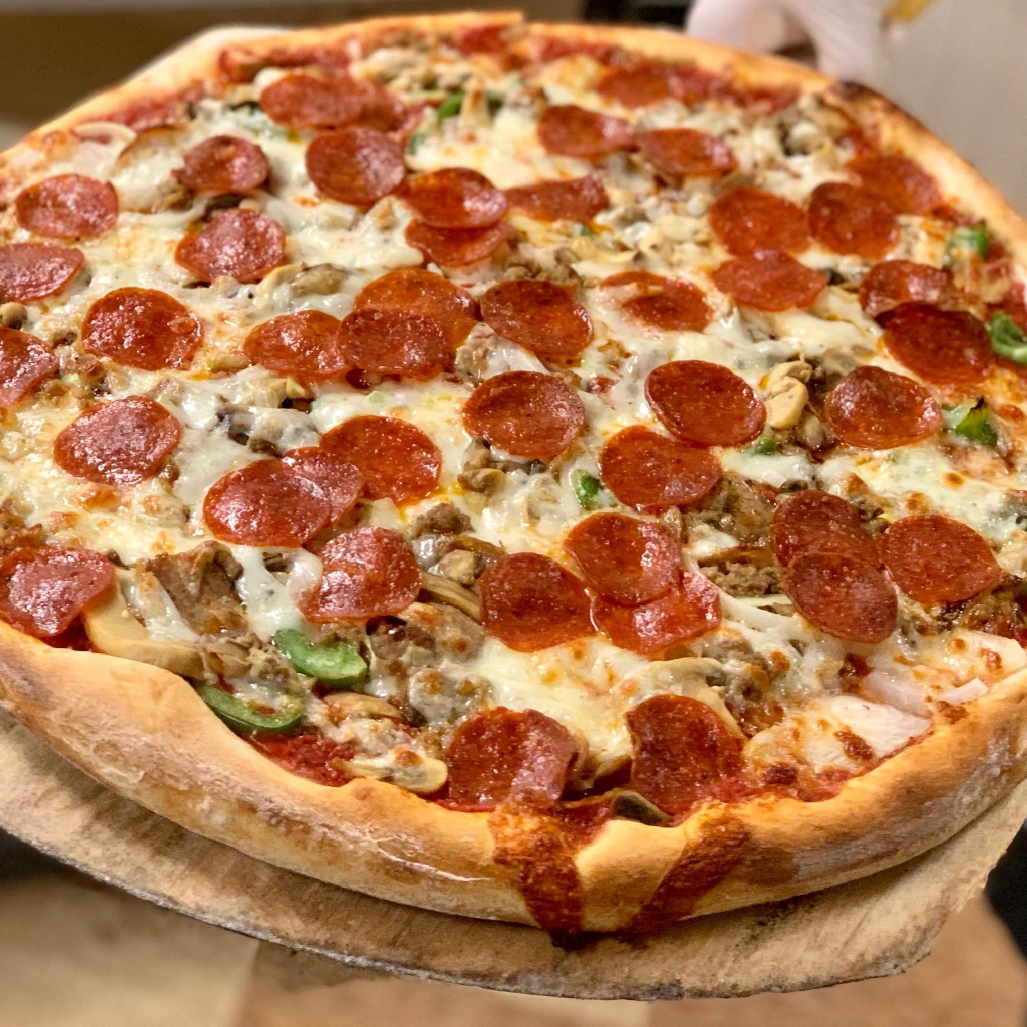 Stuffed Sausage or Pepperoni Specialty Pizza.